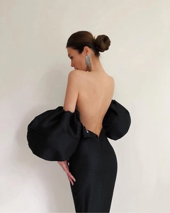 Detail of elegant black backless satin dress featuring oversized puff lantern sleeves