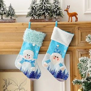 Blue LED Christmas stockings with Santa and snowman patterns hanging on a fireplace