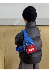 Rear view of a boy wearing a trendy blue and red crossbody chest bag with Cute lettering