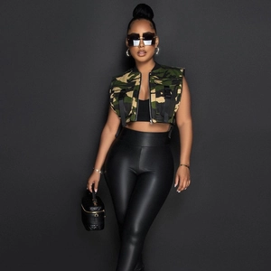 Detail shot of camo utility vest with multi-pockets and black faux leather pants