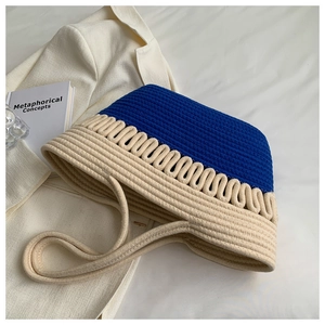 Detailed texture of Klein blue and beige cotton rope weave on a large tote bag