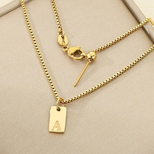 Gold box chain necklace with square initial A pendant and adjustable slider clasp