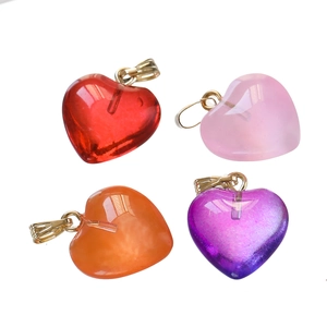 Detailed view of translucent acrylic heart pendants in red, pink, orange, and purple hues
