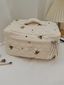 Beige quilted corduroy cosmetic bag with bear embroidery and convenient top handle