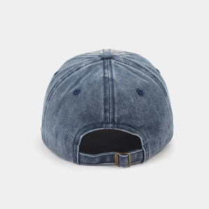 Rear view of washed navy denim baseball cap showing adjustable bronze metal buckle strap