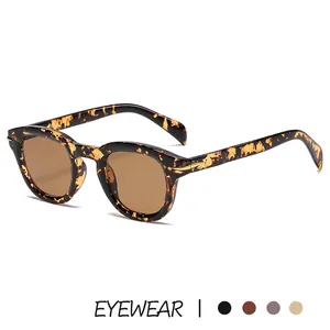 Retro oval tortoise shell sunglasses with brown lenses and golden metal accents