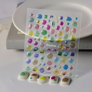 Détails d'autocollants 3D pour ongles macaron avec yeux de monstre sur pointes blanches