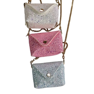 Vertical display of sequined envelope crossbody bags in white, pink, and blue with gold chains