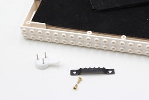 Detailed back view of white building block photo frame with mounting hardware accessories