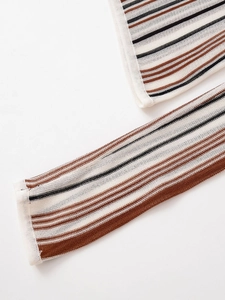 Detailed macro shot of linen blend V-neck knitwear showing fine striped texture and stitching