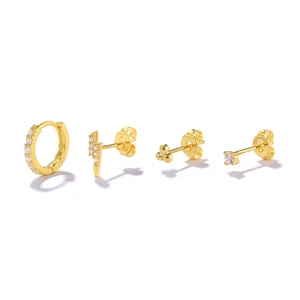Detail of four-piece gold S925 sterling silver earring set with crystals and studs