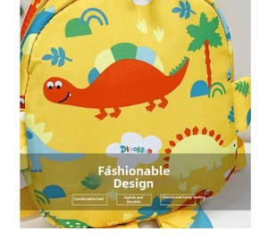 Close-up of yellow dinosaur kids backpack with durable fabric and colorful cartoon patterns