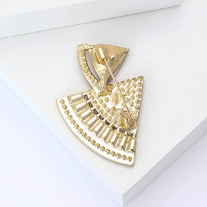 Close-up of the metal pin back and texture on the golden watermelon brooch