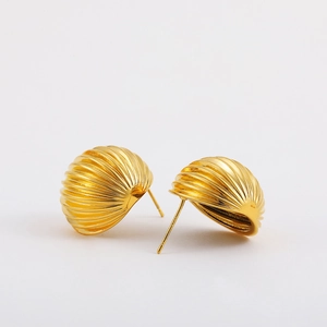 Macro shot of 18K gold plated S925 silver earrings with ribbed spherical drop design