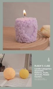 Close-up of rose flower cluster candles with intricate carved textures and cotton wicks