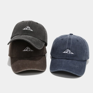 Washed cotton baseball caps with mountain embroidery in dark grey, brown, and navy colors