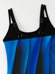 Detail of adjustable black shoulder straps with silver metal rings on printed tankini top