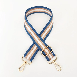 Detail of adjustable nylon bag strap with navy blue and rose gold glitter stripes