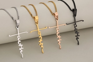 Detail view of faith cross pendants in silver, gold, rose gold and black finish