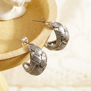 Silver woven teardrop earrings in polished stainless steel with mesh texture