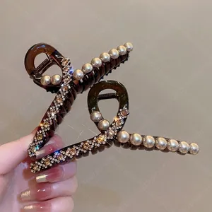 Elegant large amber resin hair claw clip with cream pearls and sparkling crystals
