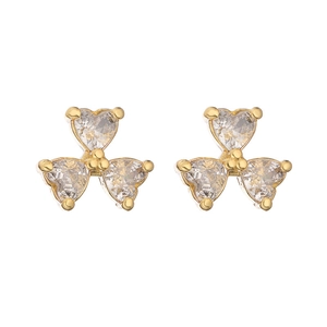 Detail of gold-plated clover earrings featuring three heart-shaped faceted crystals