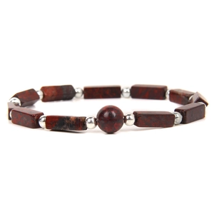 Macro shot of natural red jasper rectangle beads bracelet with silver spacers and center bead
