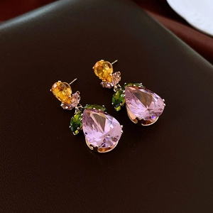 Detail of gold leaf earrings with pear-shaped pink crystal and colorful zircon accents