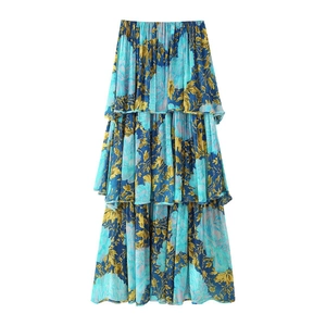 Detailed view of bohemian layered chiffon tiered skirt with blue and yellow floral print