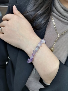 Wrist-worn view of irregular purple amethyst stone chip bracelet on a model