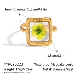 Detail view of square gold stainless steel ring with dried flower resin and sizing data