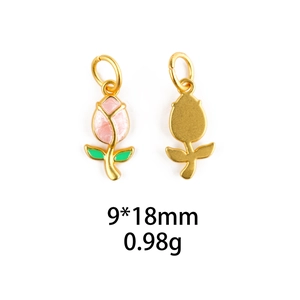 Detailed macro view of pink enamel tulip pendants with gold plating and size labels