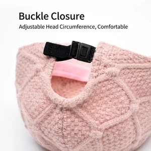 Pink knit baseball cap with diamond pattern and adjustable back strap for winter warmth