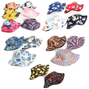 Selection of vibrant tie-dye and tropical palm leaf print reversible bucket hats