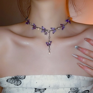Detail of silver irregular butterfly choker with purple crystal waterdrop pendants