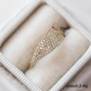 Elegant 7mm gold pavé ring weighing 2.4g displayed in a luxury velvet jewelry gift box