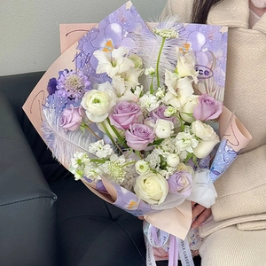 Detail of purple roses and white lisianthus in multilayered Korean style flower wrapping