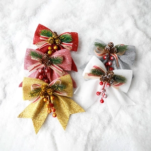 Glitter Christmas bows set in red gold silver and white with pine cone and berry accents