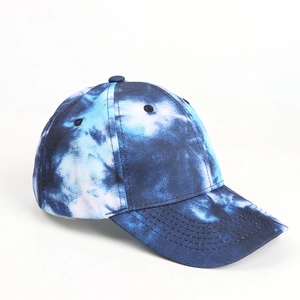 Detail view of the blue and white tie-dye cotton baseball cap with a curved brim design