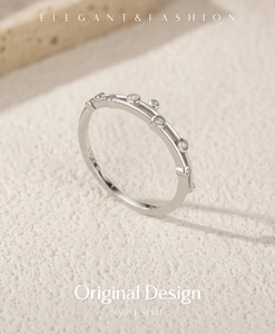Detailed macro of S925 sterling silver ring with small clear round zirconia stones