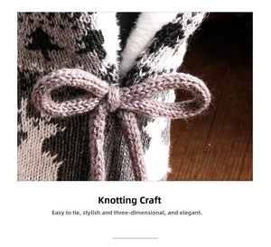 Detail shot of the red wine bottle cover with knit texture and plush fleece lining