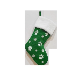 Detail of green Christmas stocking with white paw prints and soft faux fur cuff