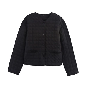 Women's black quilted round neck jacket with buttons and front pockets in a minimalist style