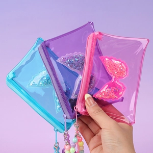 Three transparent PVC glitter wing coin purses in blue, purple, and pink with sequins