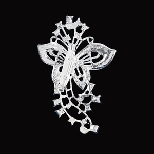 Silver hollow butterfly brooch back view showing secure metal pin closure mechanism