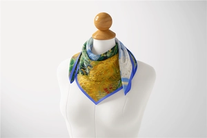 Detail of square silk scarf with Van Gogh Wheatfield oil painting print on a mannequin