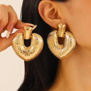 Chic oversized golden heart hoop earrings with retro vertical texture for women