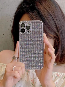 Close-up of glittery rhinestone phone case for iPhone with integrated lens protector