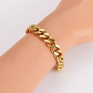 Classic gold stainless steel Cuban link bracelet for men and women on model wrist