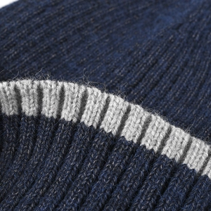 Thick navy and grey rib-knit beanie with warm fleece texture for outdoor winter warmth